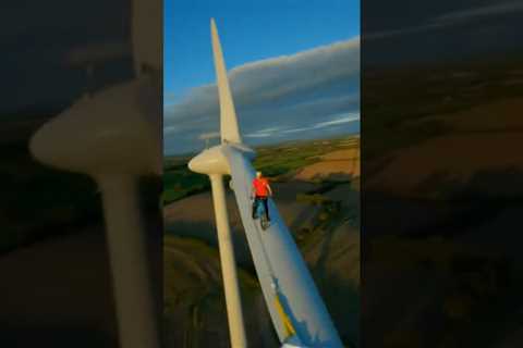 Riding Bike on Wind Turbine! 😬 #shorts